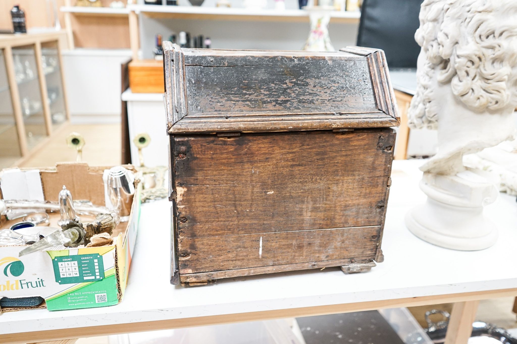 An unusual early 18th century Continental painted chestnut, oak and walnut table-top trunk with concealed drawers 38cm